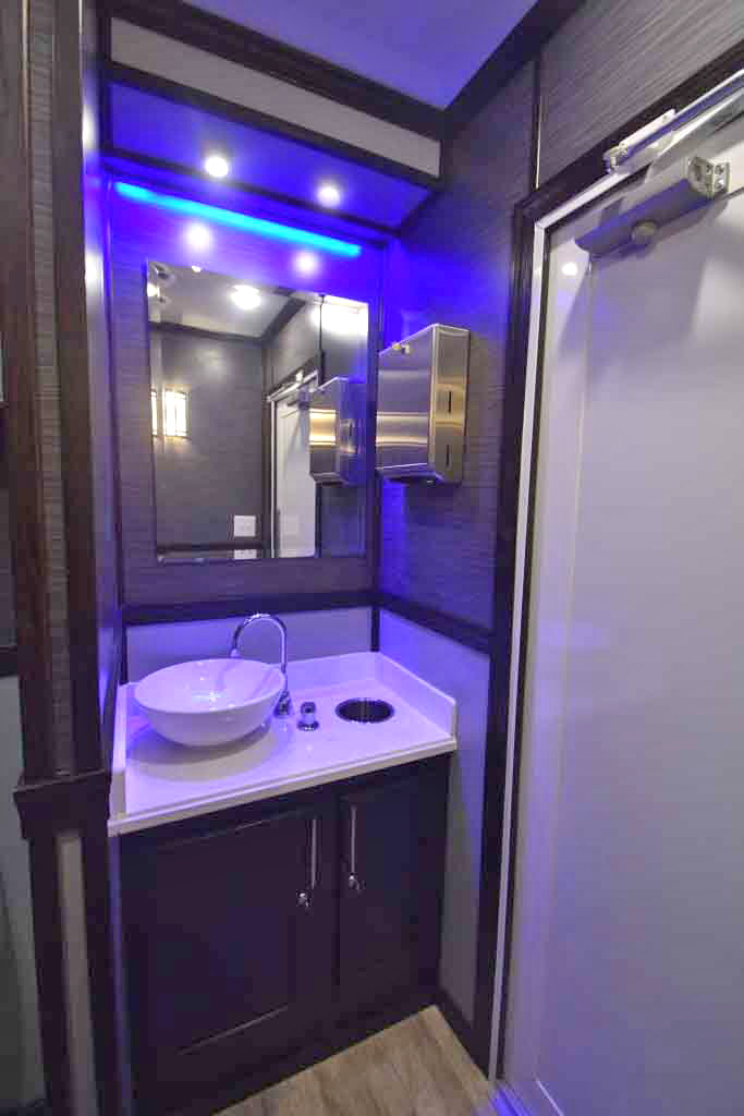 BLUE ACCENT LIGHTING IN FIVE STATION RESTROOM TRAILER